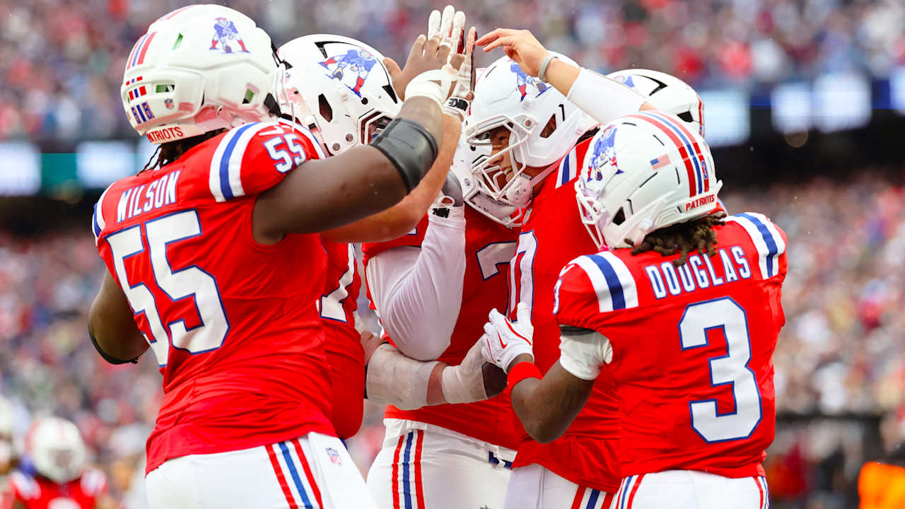 New England Patriots players in the official Raiders game coverage.