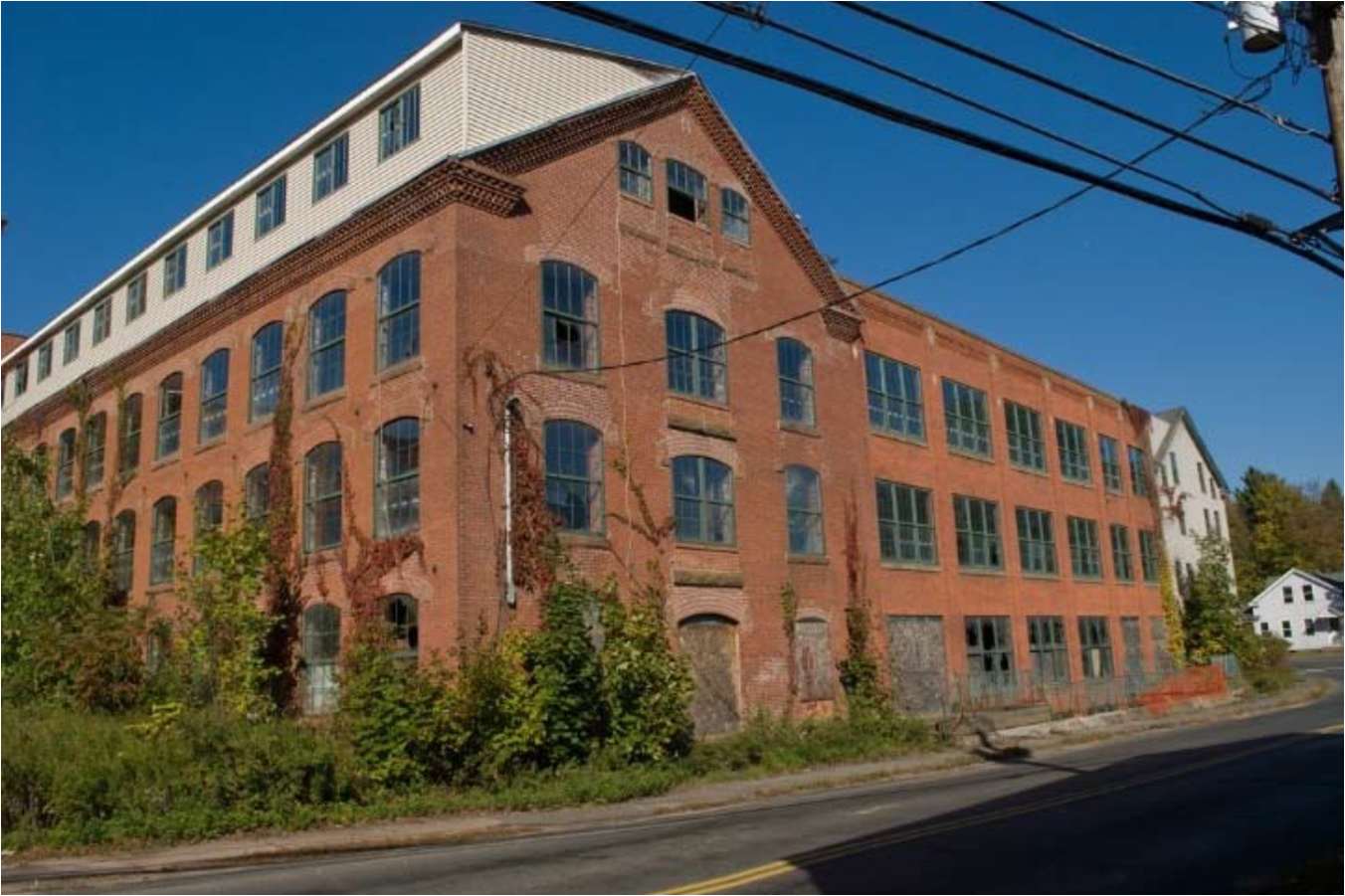 Archive photo: The former Somersville Mill before the 2012 fire. The building shown here no longer stands; the town’s redevelopment discussions concern its former site.